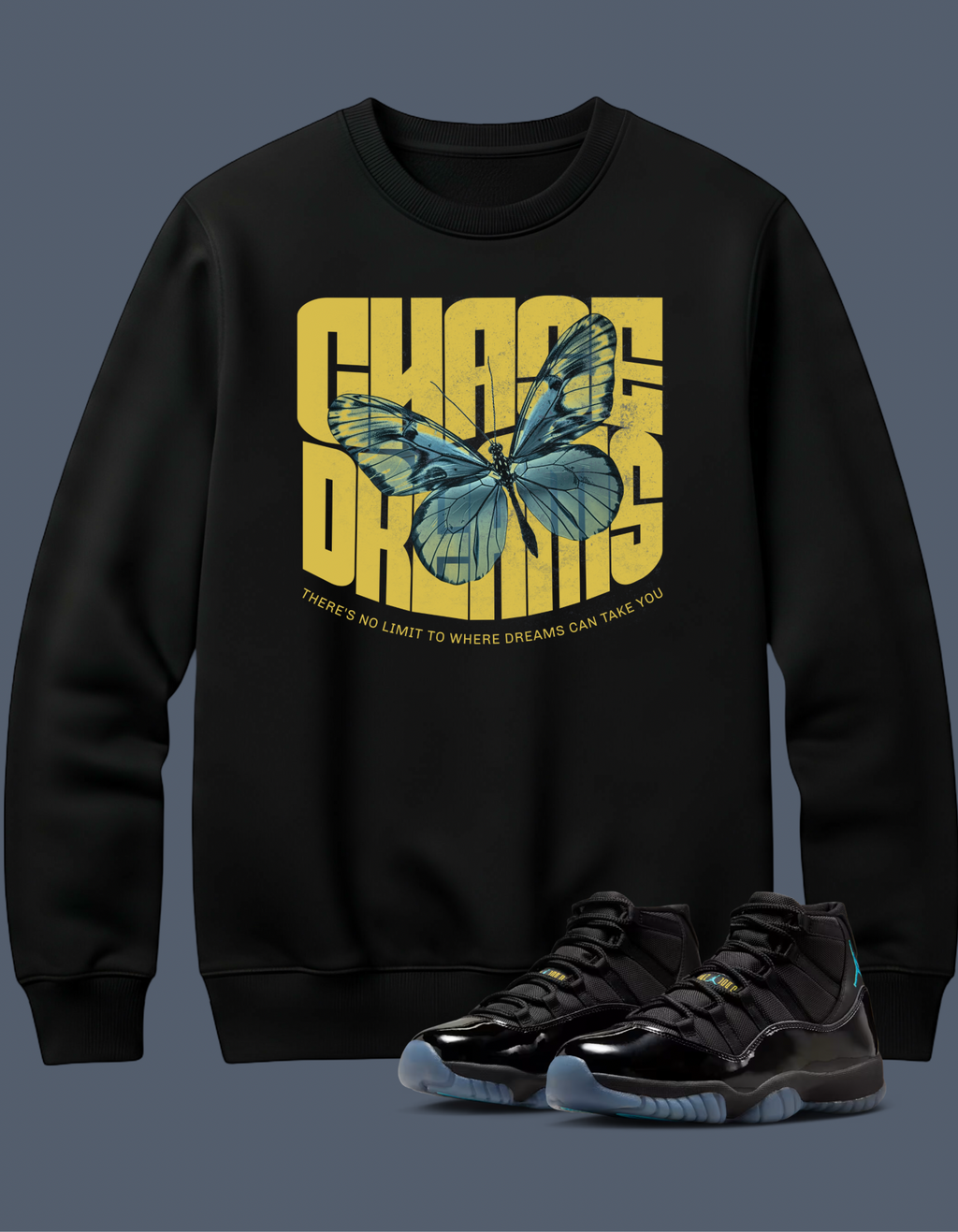 Black sweatshirt with butterfly graphic and text, Chase Dreams, paired with black sneakers on a dark background