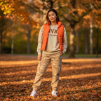 Asian woman wearing ENVNO1 sweatshirt with tan camo pants in fall outfit